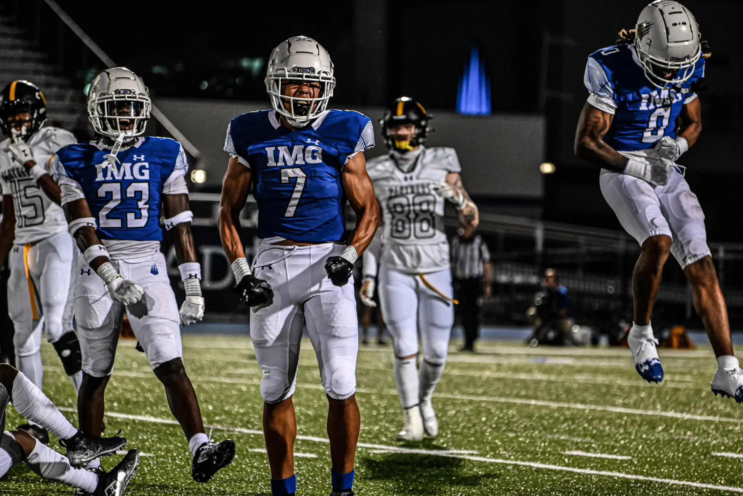 Football players JJ Rubell (left), Alex Graham (middle), Major Preston Jr. (right) from IMG Academy National celebrating in sports photography photo
