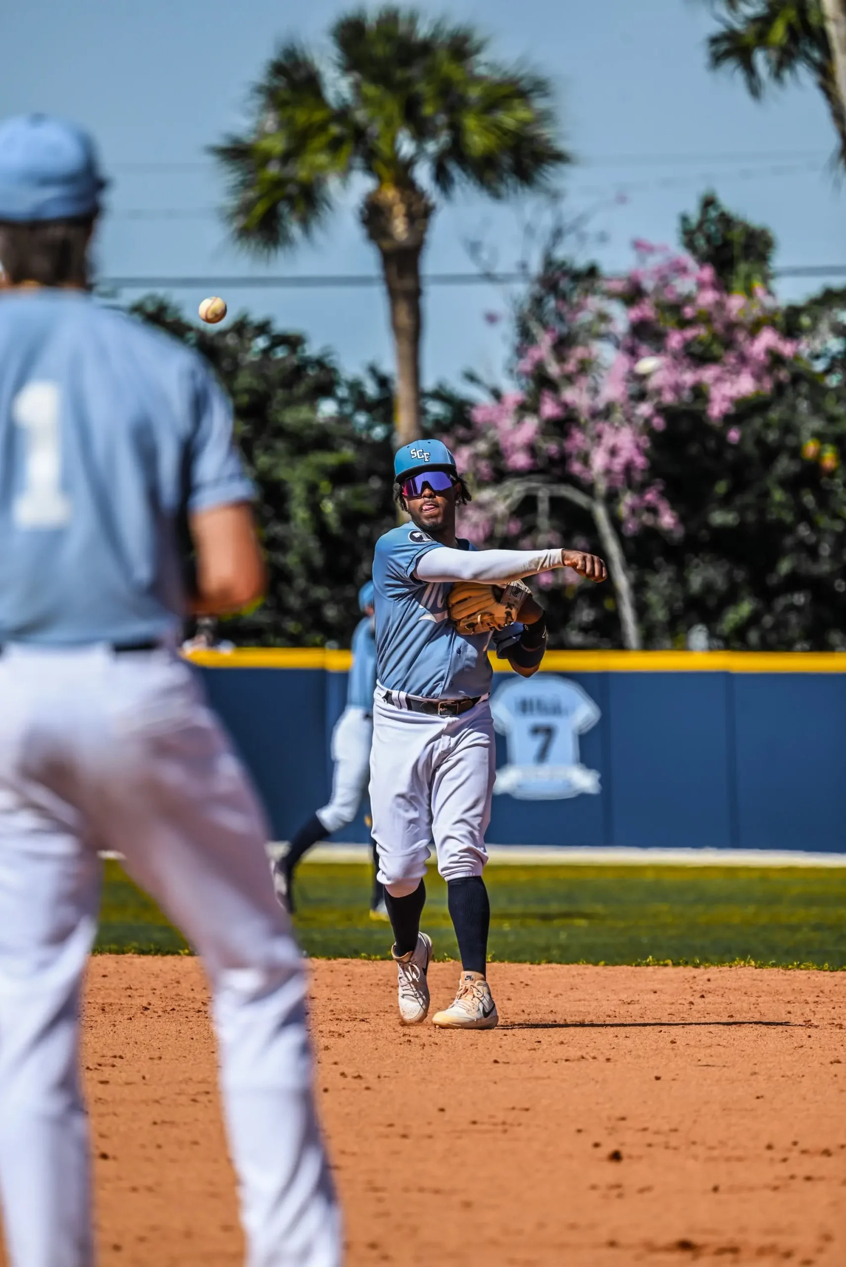 State college of Florida baseball teammates warming up in the sports photography photo